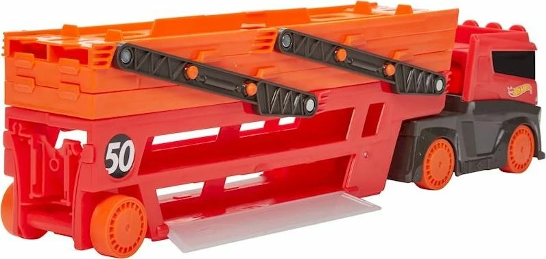 Kamion transporter lodër Hot Wheels Mega Transporter GHR48, 50th Anniversary, mban deri 50 makina, portokalli