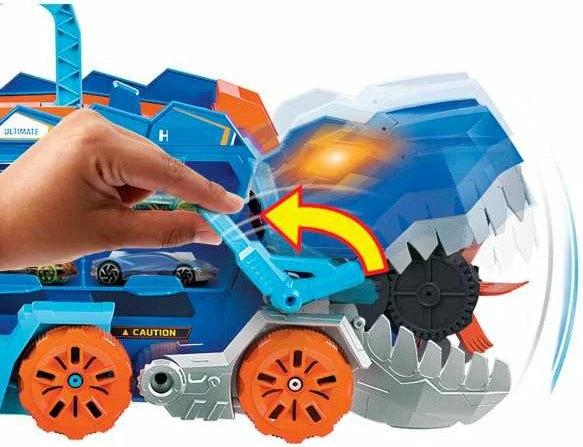 Set garazh/transportues dinosauri Mattel Hot Wheels City T-Rex Mega Transporter HNG50, me drita e tinguj, ruan 20+ vetura, me 2 vetura 1:64, blu/portokalli