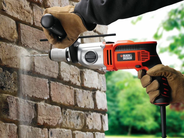 Burmashinë me goditje Black&Decker KR8542K 850 W, mandrinë 13 mm, 2 shpejtësi, me kuti aksesorësh, e zezë/portokalli