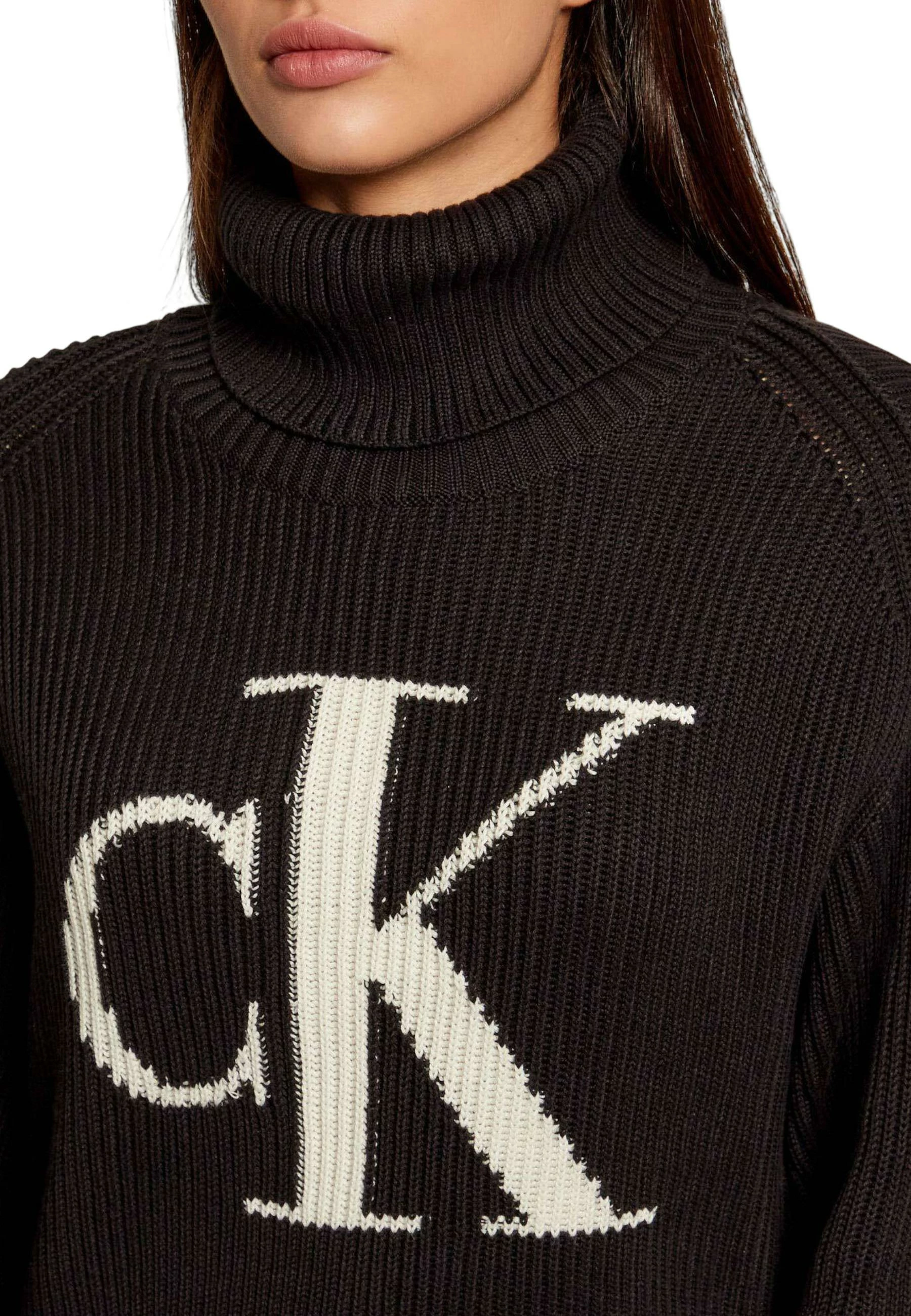 Xhemper për femra Calvin Klein Jeans Contra LV047D349G, i zi [Madhësia: XXS]