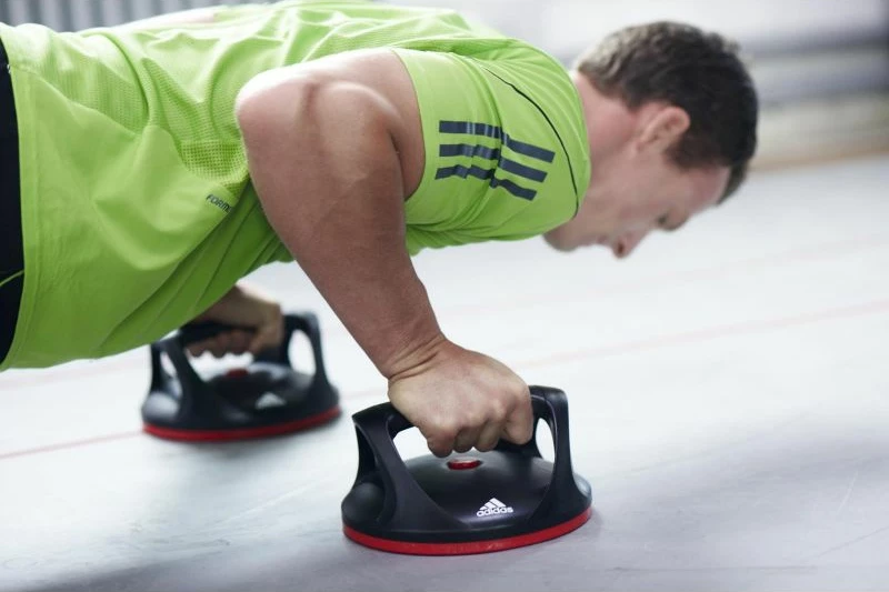 Mbajtëse rotulluese për push-up adidas, për meshkuj dhe femra, të zeza me të kuqe
