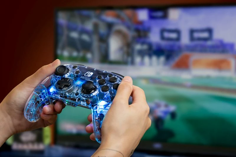 Pad wireless PDP Afterglow Deluxe 500-137-EU, LED prismatic, për Nintendo Switch, transparent