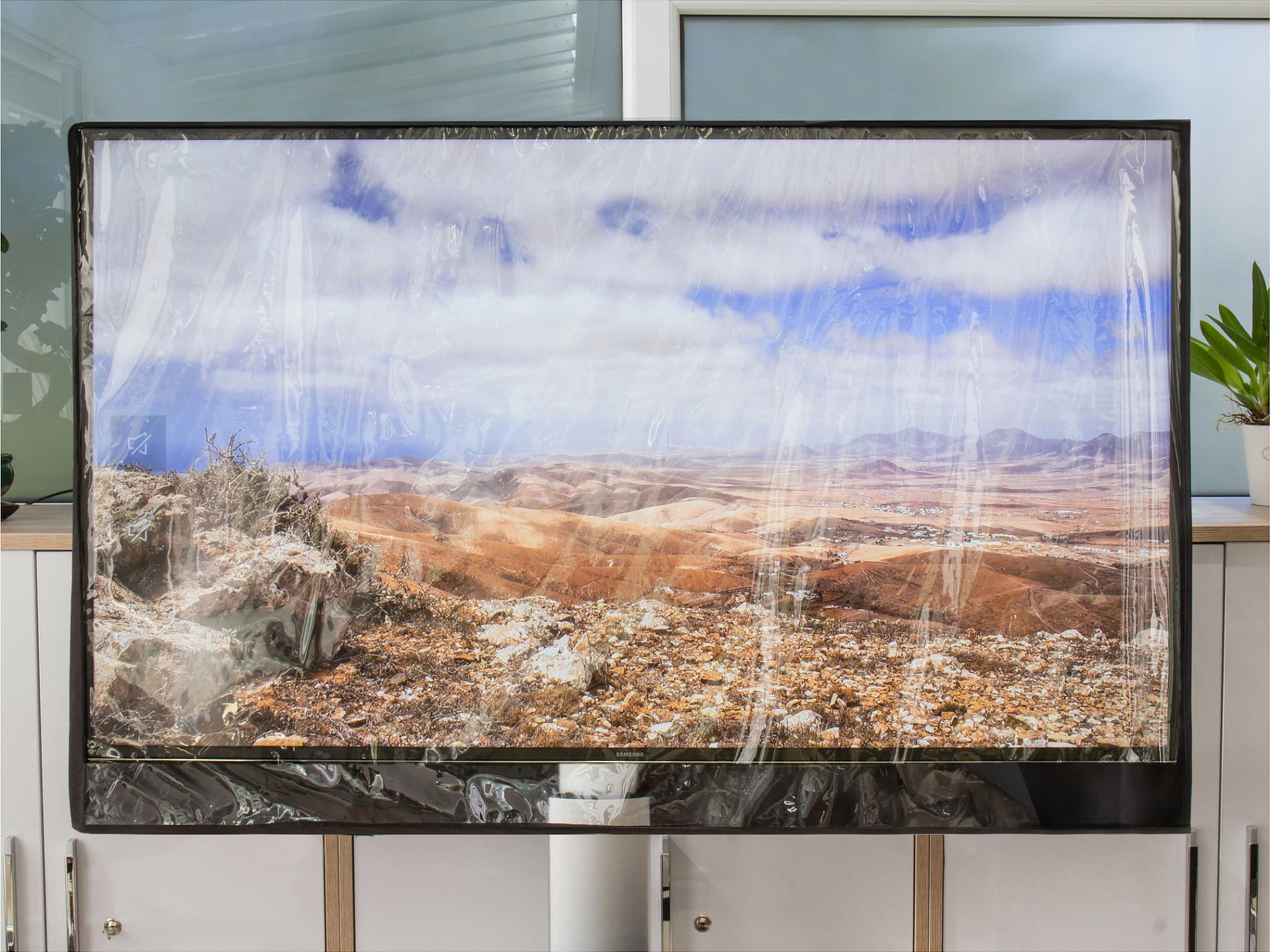 Mbështjellës për TV Python TV-Cover 78x48cm, për 28"-32", i papërshkueshëm nga uji, zi/transparent