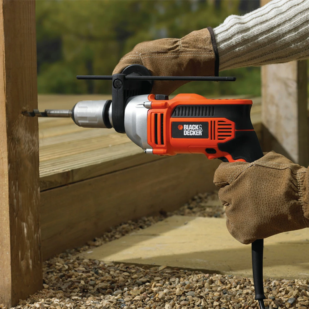 Makinë shpimi me goditje Black+Decker KR705K 750 W, mandrinë 13 mm, me kuti veglash, e zezë/portokalli