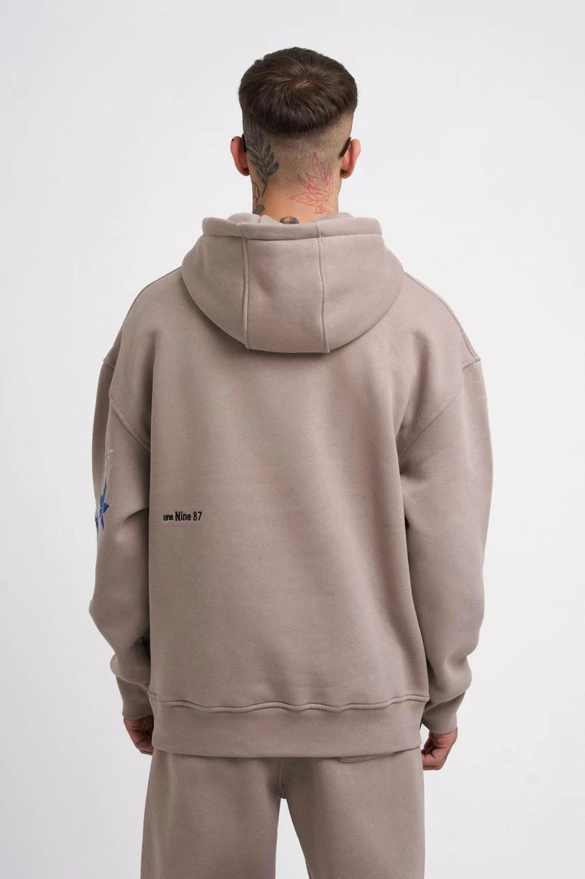 Duks oversize me kapelë dhe figurë Machinist, krem