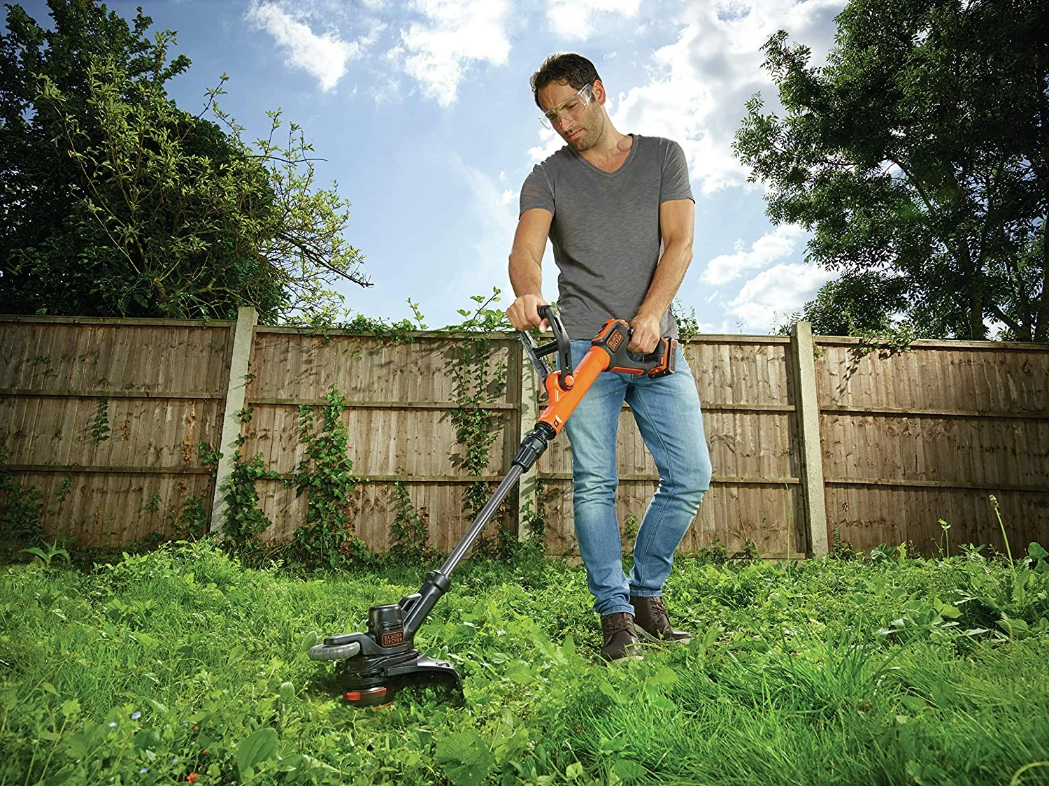 Trimmer bari me bateri Black&Decker STC1820EPC 18V 2.0Ah portokalli/zi, me bateri dhe karikues