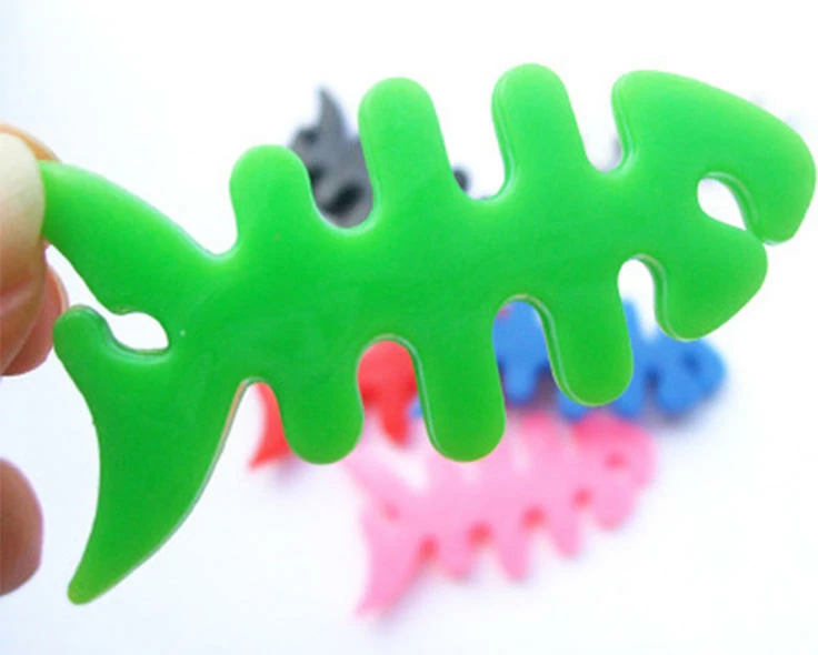 Mbështjellës kabllo për kufje Hurtel, formë peshku, plastikë, i gjelbër