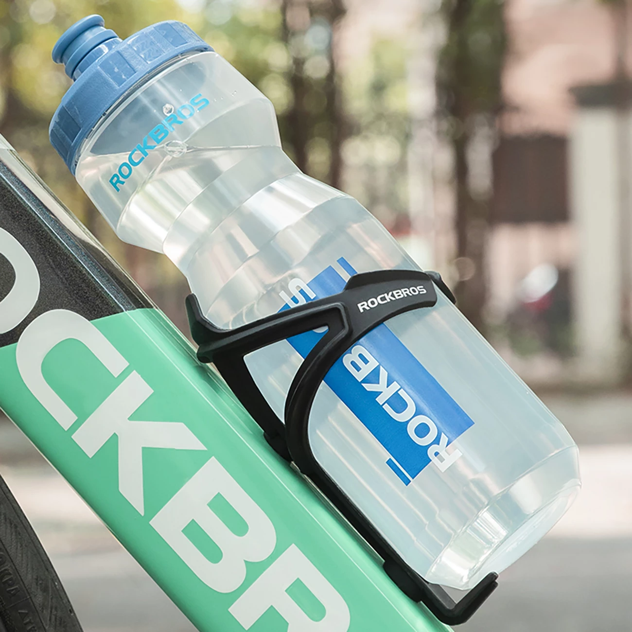 Shishe uji për biçikletë Rockbros Sports Bottle 750 ml, transparente me grykë blu